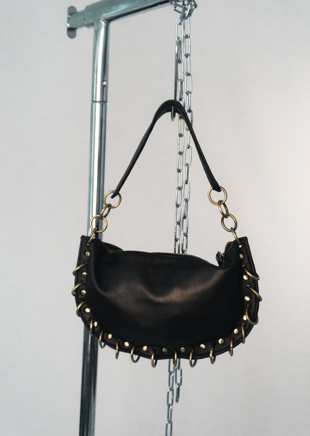PIERCED BLACK BAG