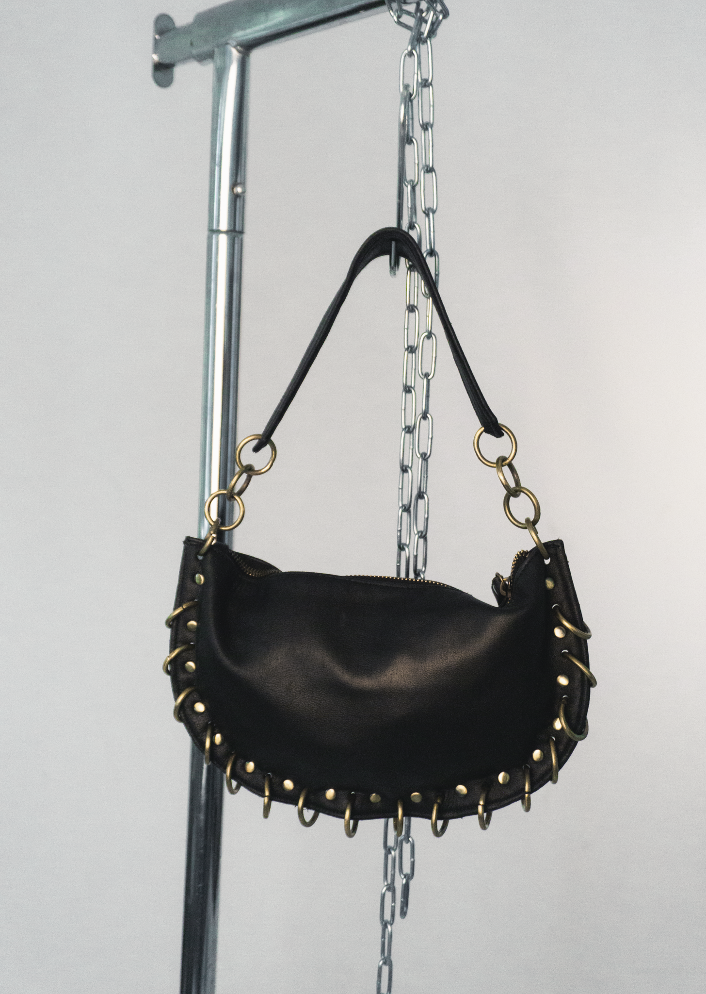 PIERCED BLACK BAG